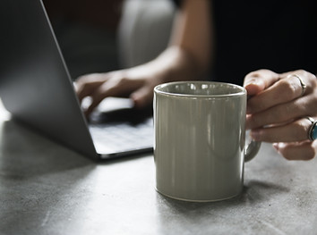 Beverage Mug and a Laptop