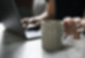 Beverage Mug and a Laptop