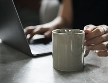 Beverage Mug and a Laptop