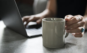 Beverage Mug and a Laptop