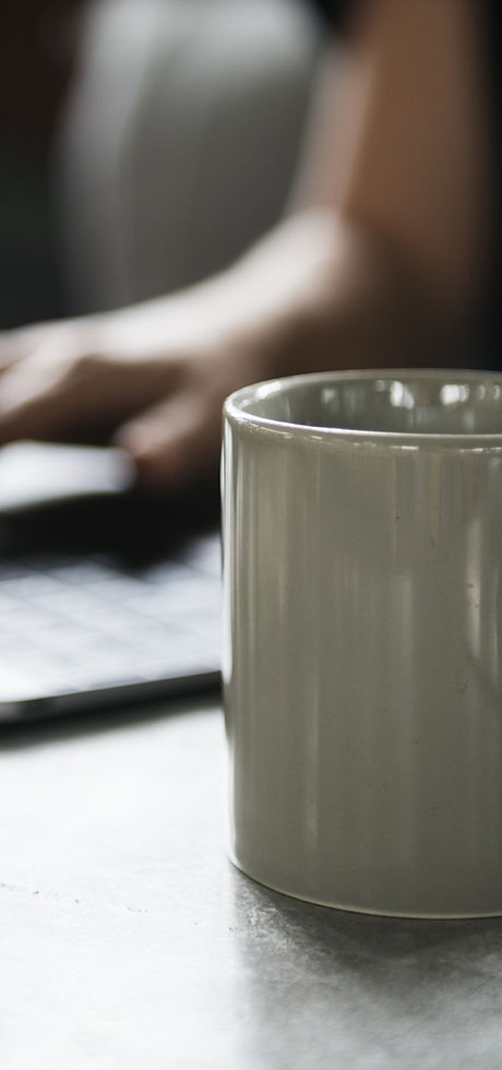 Beverage Mug and a Laptop