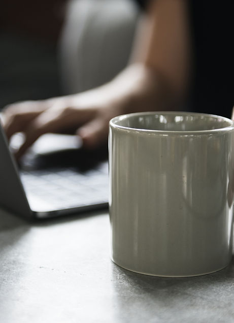 Beverage Mug and a Laptop