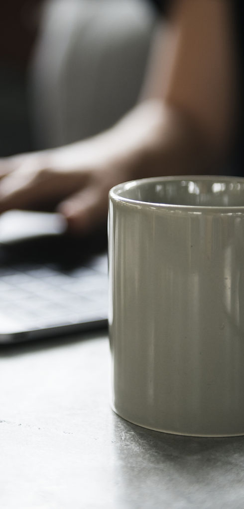 Beverage Mug and a Laptop