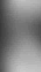 A couple walks on the terrace at Laurel Hall for their wedding