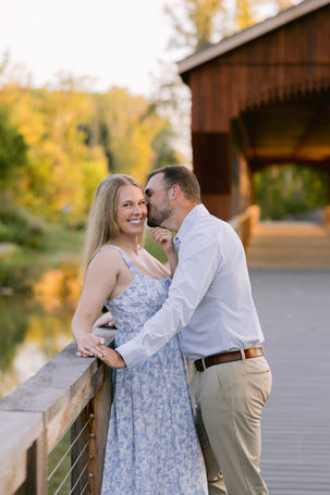 Geist Park engagement photos in Fishers Indiana featuring a couple walking along a wooded trail during a natural outdoor session captured by a Fishers engagement photographer.