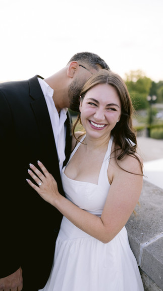 Nicole smiling over her shoulder as Kevin looks at her lovingly.
