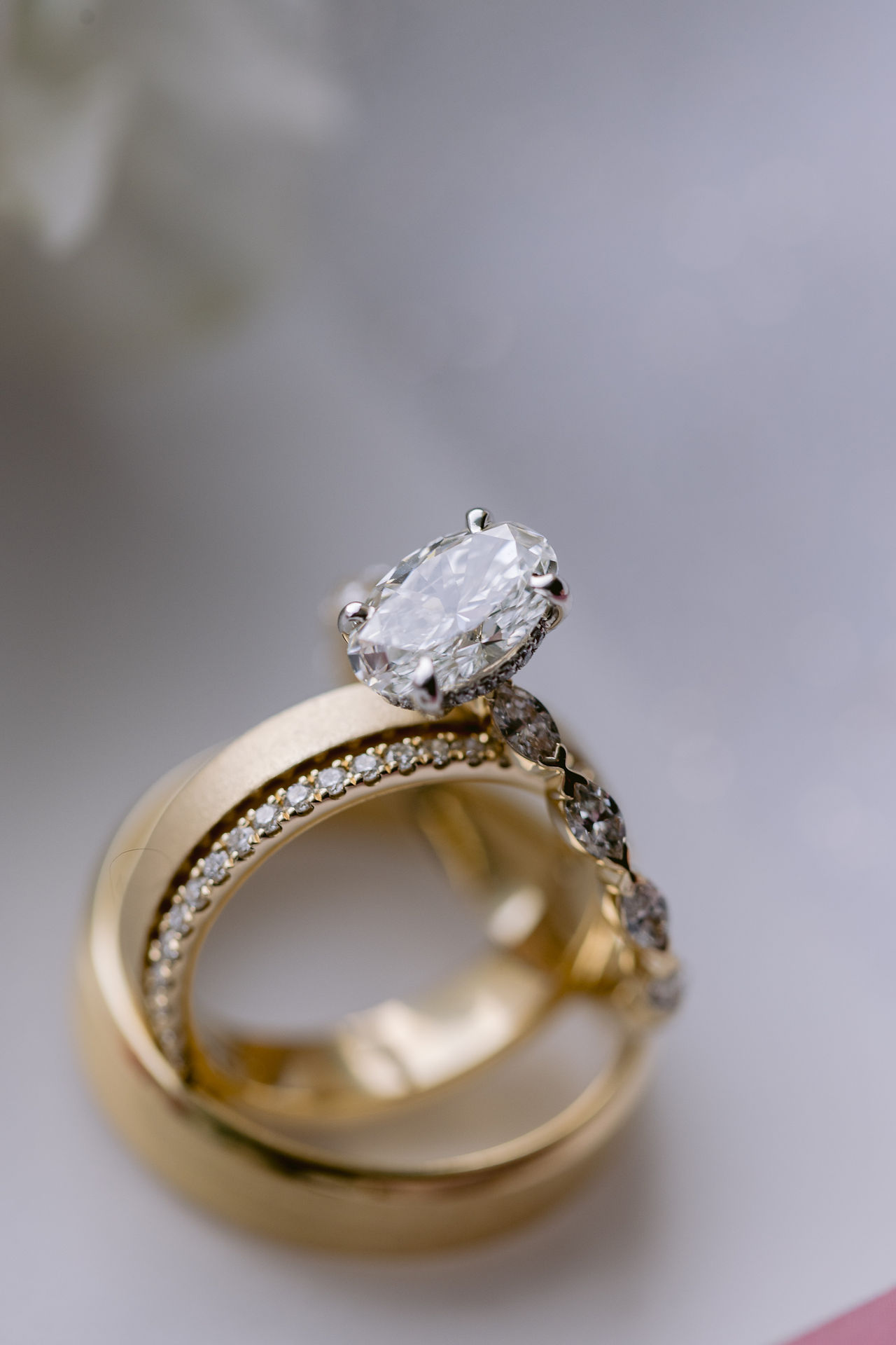A bride and groom's wedding bands on display