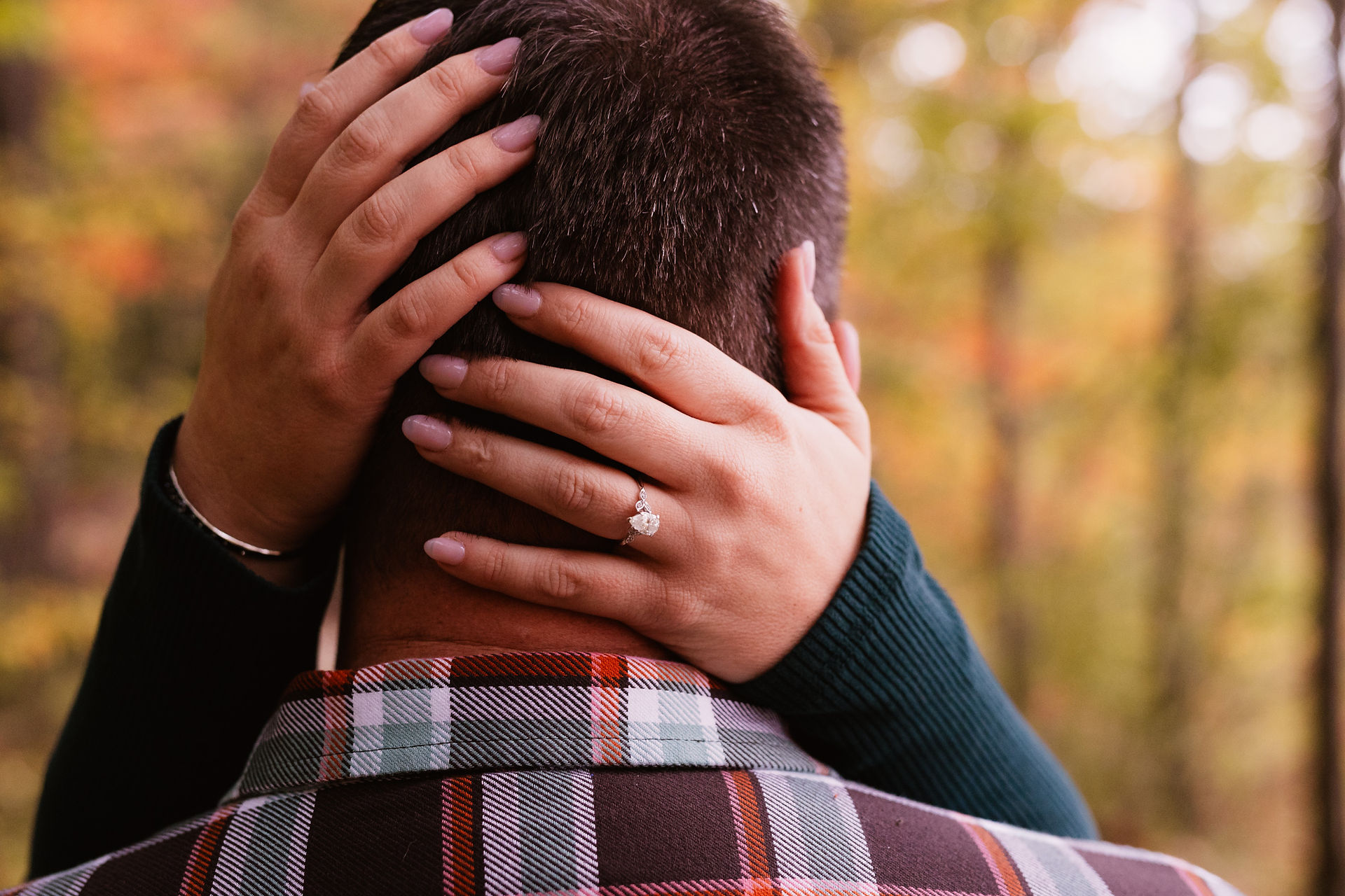 Jen & Will's engagement photos at Eagle Creek Park amid vibrant fall foliage.