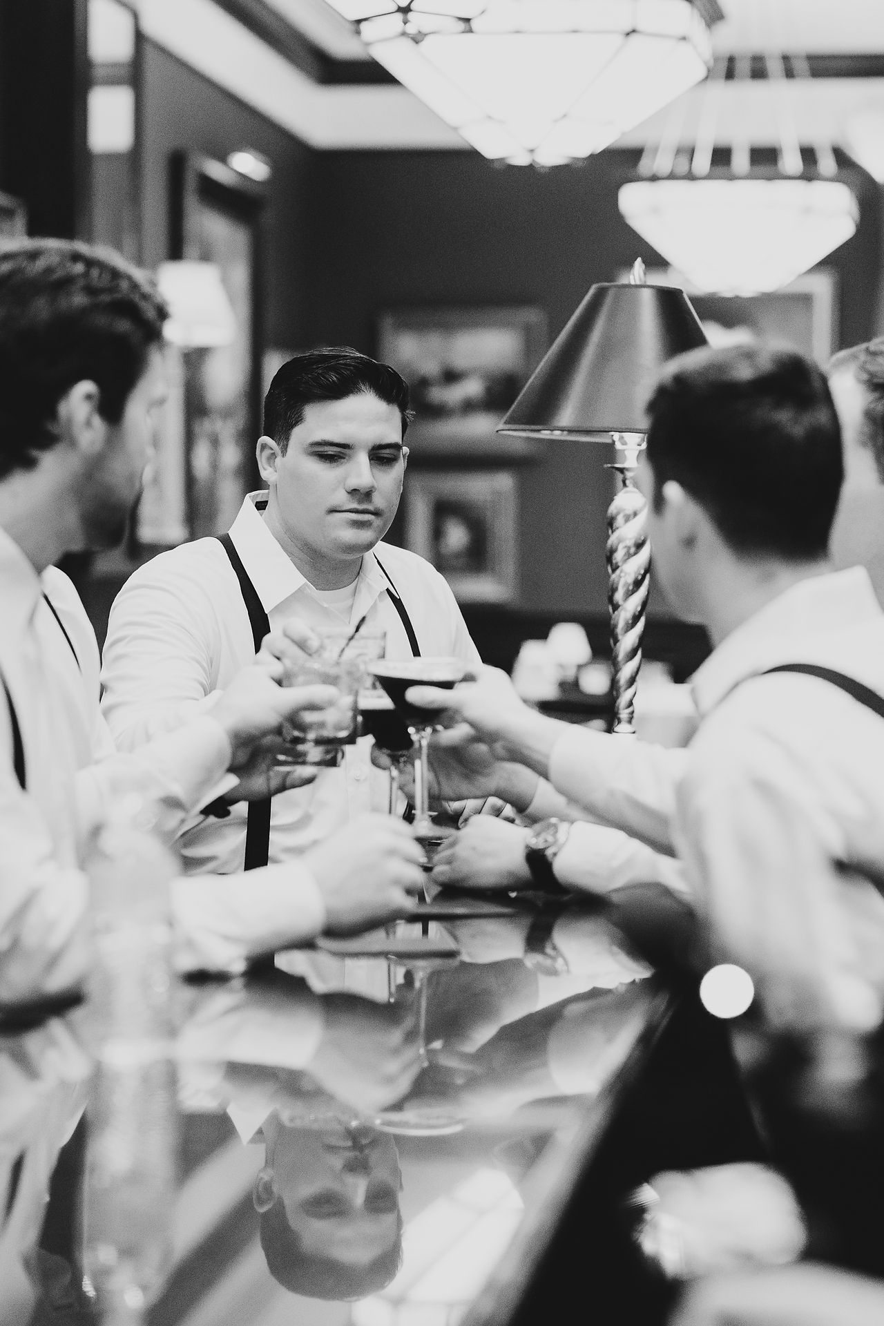 A groom and his crew grabbing drinks before the wedding