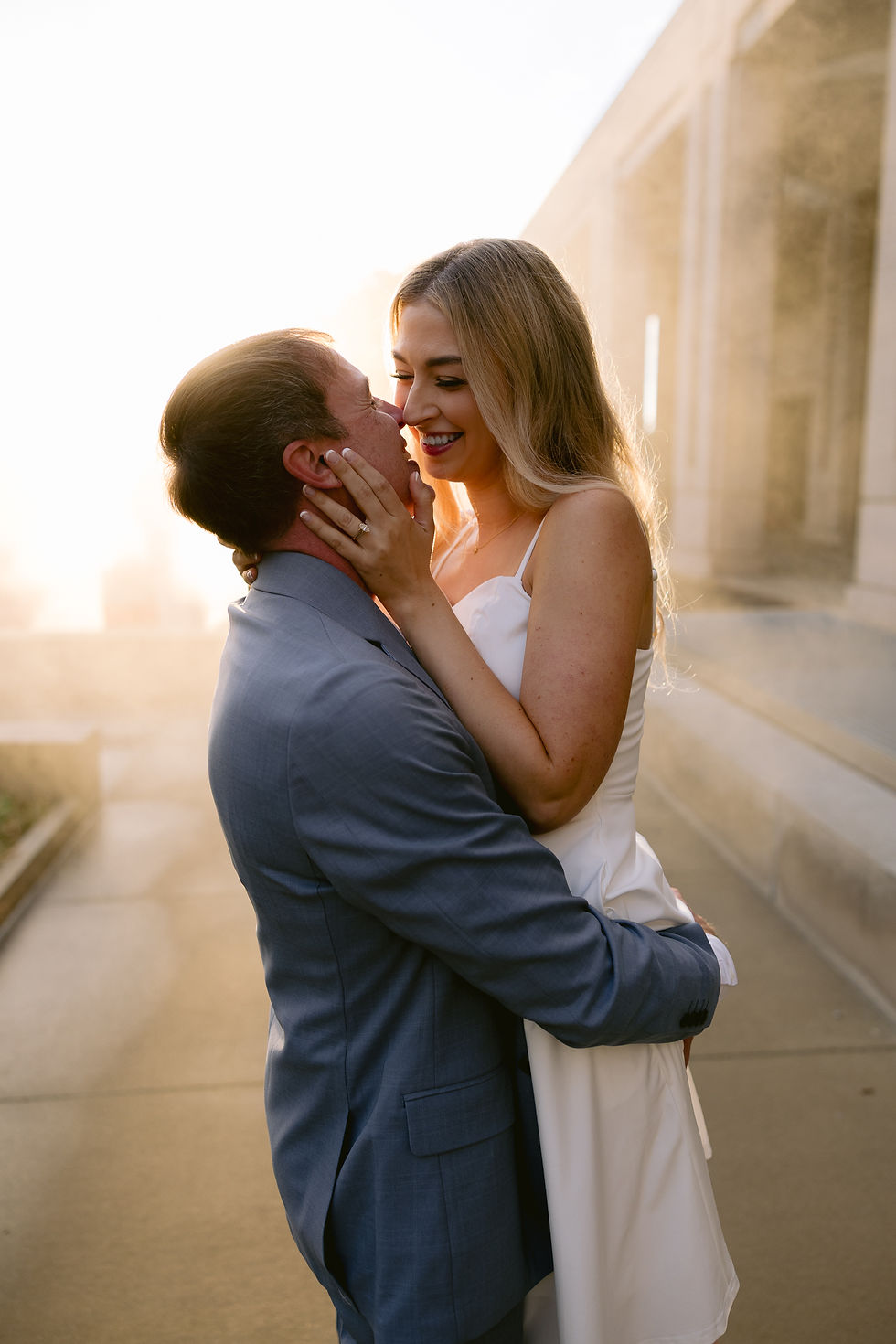 Romantic photo of couple by the water at golden hour