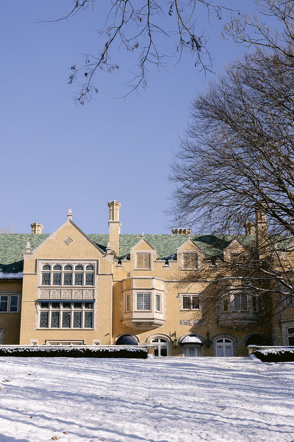 Exterior of Laurel Hall covered in fresh snow during a winter wedding in Indianapolis.