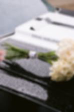 Close-up wedding detail of blue jay remembrance pin honoring bride’s late father during Indiana wedding