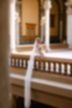 Indiana State House wedding photography showing newlyweds walking hand in hand through the historic rotunda.