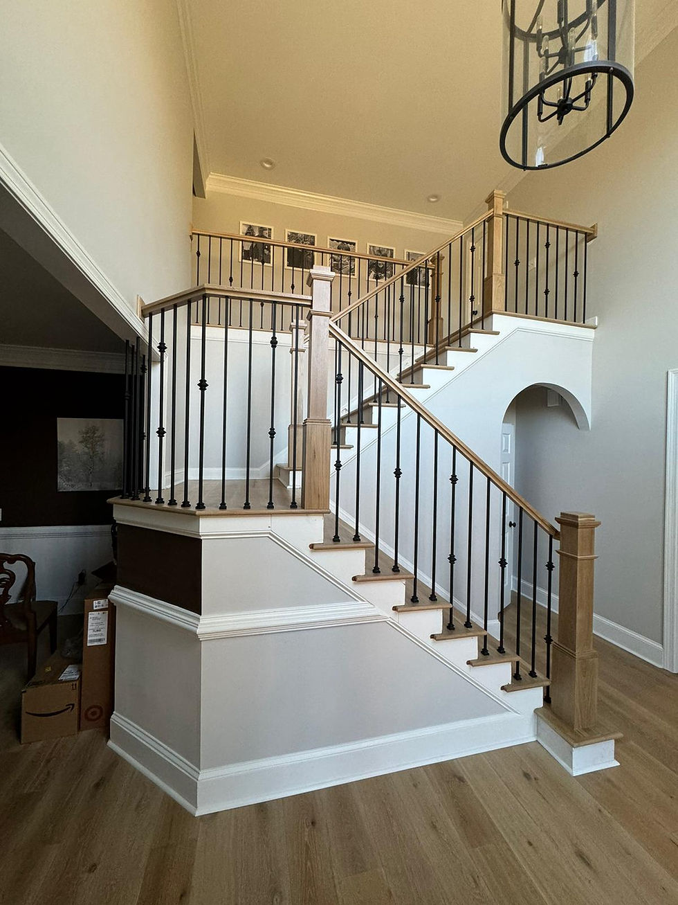 Modern wooden stairs and railing with metal balusters in Buford, GA by Seta Hardwood Flooring