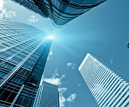 Blue sky and clouds above software company buildings