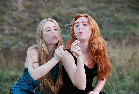 Sophie and Jules with dandelion.jpeg