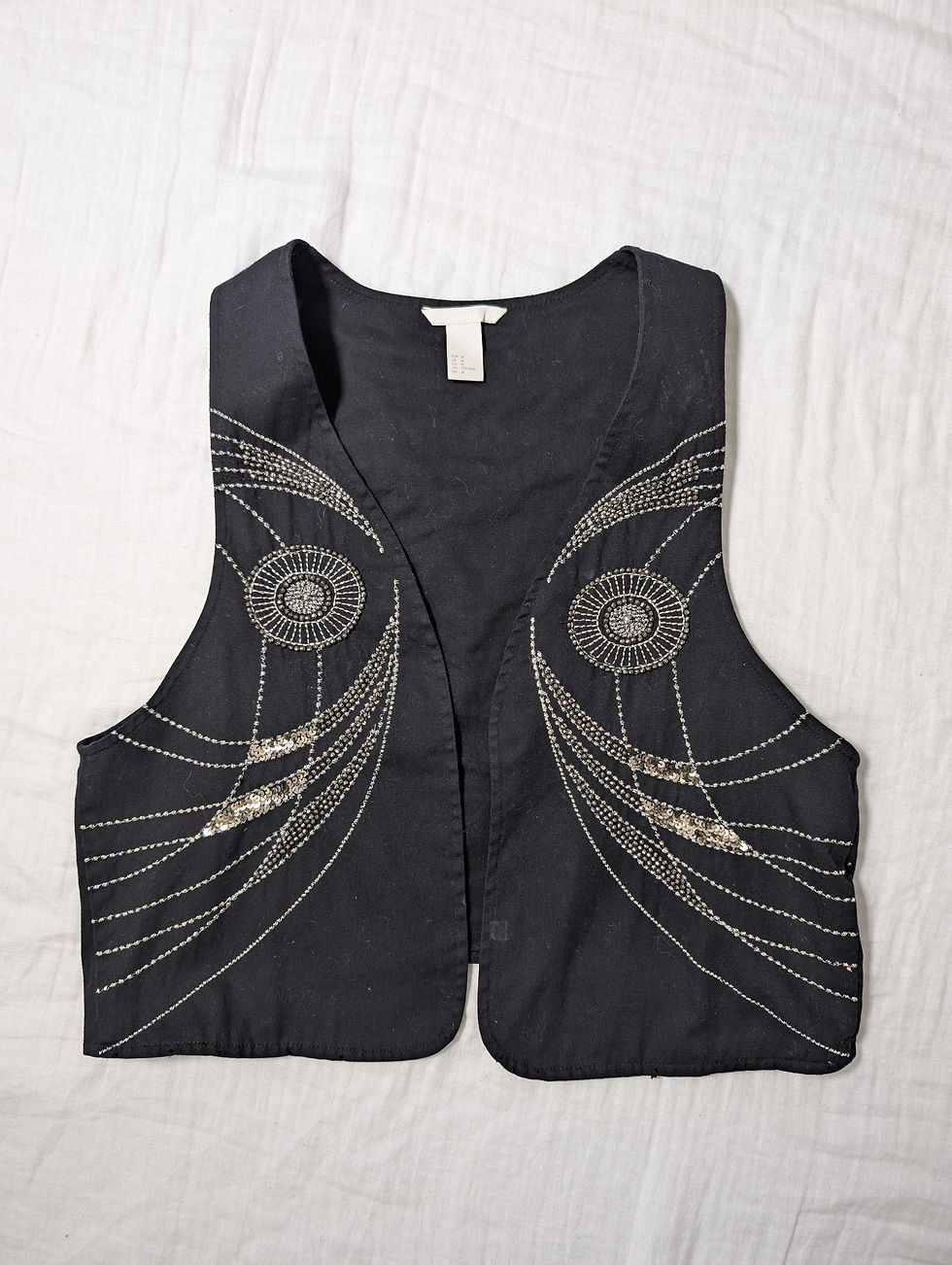 Miniaturebillede: H&M sort vest med dekorationer (M)