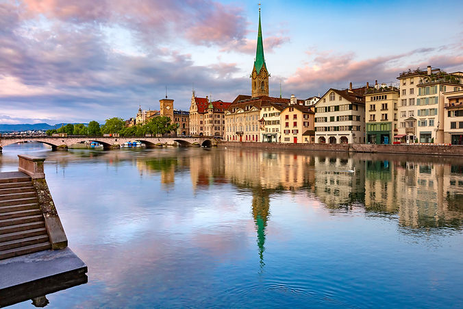 famous-fraumunster-church-with-reflections-river-limmat-pink-sunrise-old-town-zurich.jpg