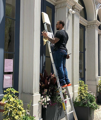 Simon Dessus providing window cleaning services for a commercial client in Philadelphia