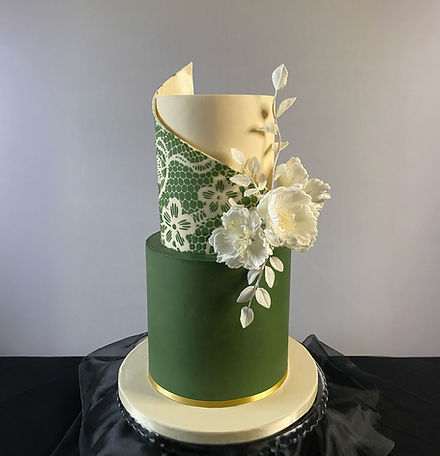 Tall two-tier statement floral wedding cake with sugar flowers in Leicester