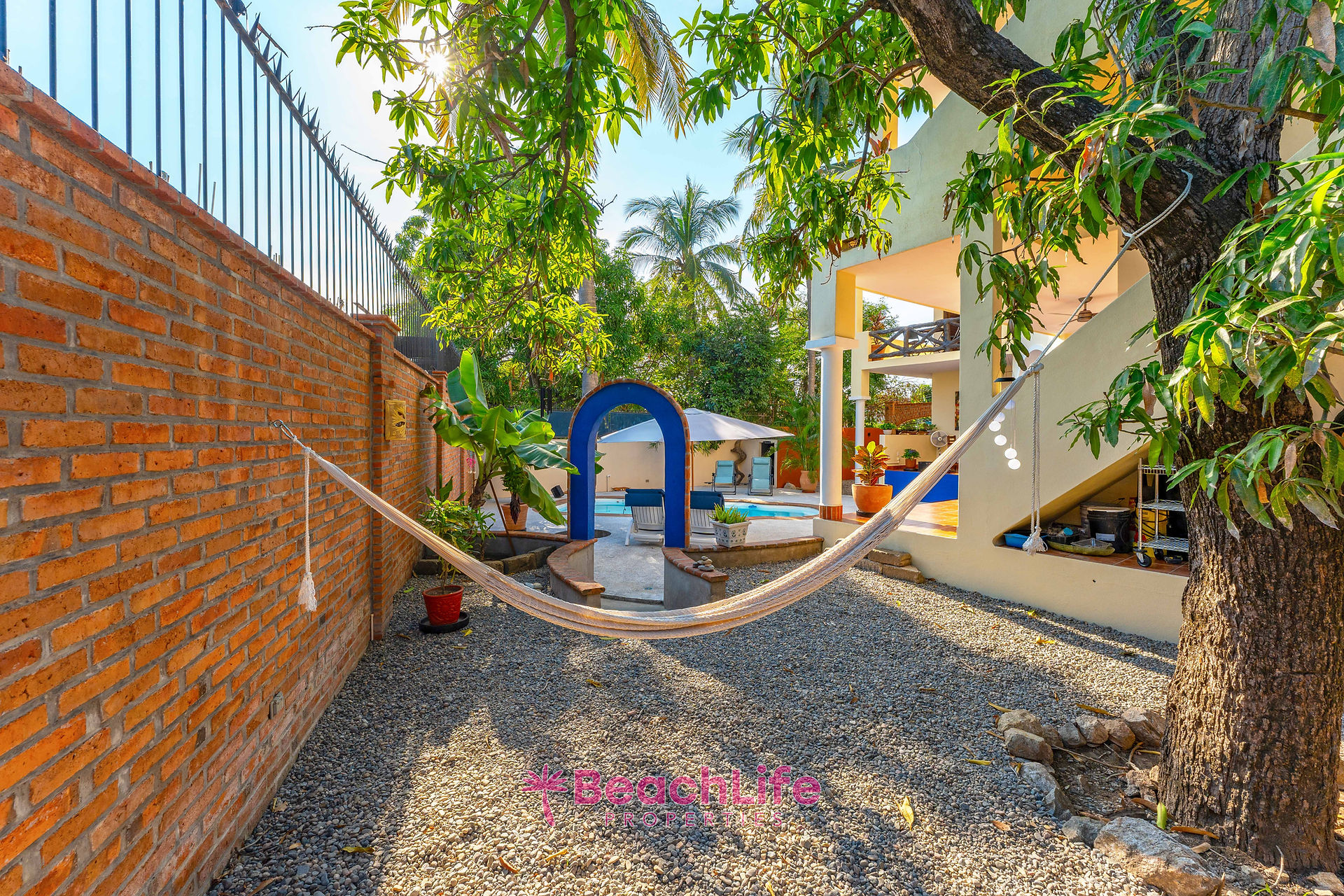 Garden and hammock overlooking the pool