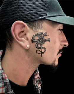Black and Grey Illustrative Face Tattoo