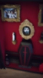 Dracula-themed book nook featuring a portrait of Count Dracula with a gothic seaside town in the background, framed in a blac