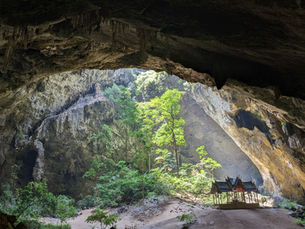 nside the cave, witness nature's play of light as sunbeams pierce through openings, casting a mesmerizing glow on the pavilion. It's a simple yet enchanting spectacle.