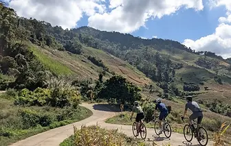 Cyclists on a rural road near the Golden Triangle, Chiang Rai
