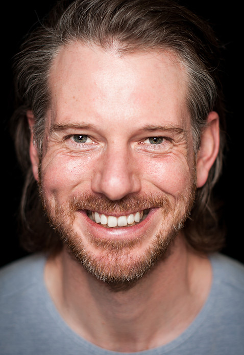 Bild des lächelnden Gesichtes des Coachs Florian Schmidt
