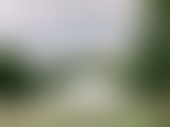 Elegant marquee wedding set up in the garden of a private home, with draped interiors and formal table settings