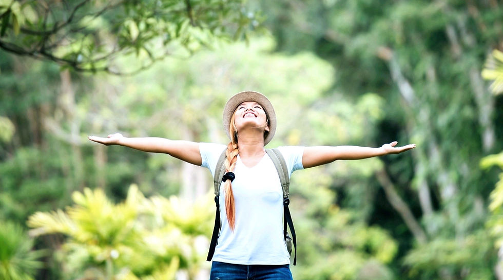 young-happy-woman-with-backpack-raising-hand-enjoy-with-nature_edited_edited_edited_edited