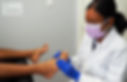 Lisa Balkarran assessing patient's foot