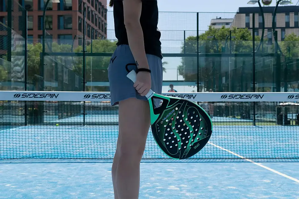 Pickleball player with racket and balls on the court, focus on equipment and preparation