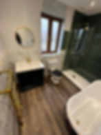 New tiled walk-in shower with rainfall head – bathroom refit by H&K Plumbers