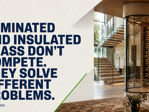 Floor-to-ceiling laminated glass wall in a Dallas luxury home with natural light and custom wood finishes