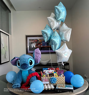Custom gift basket with plush toy, snacks, and themed decorations for hotel delivery in Orlando