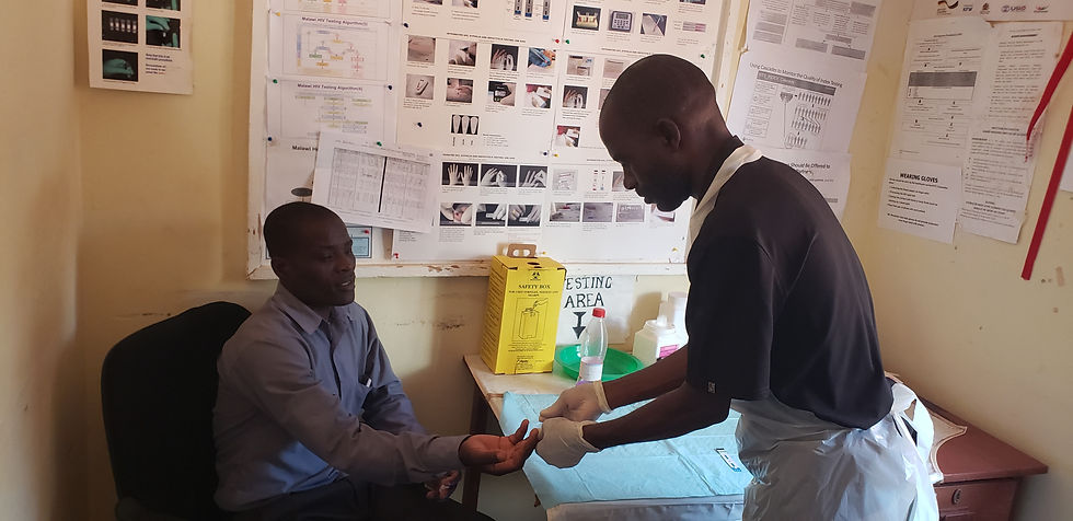 Close-up view of educational materials on sexual health laid out on a wooden table