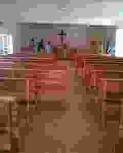 Members of Iglesia Santo Tomas are helping move the twenty-five new pews into the sanctuary of Iglesia Santo Tomas.