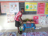 Woman viewing educational and community project information displays