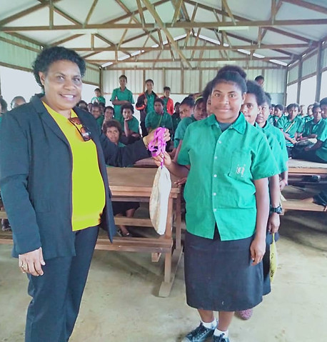 PNG students receiving re-usable menstrual kits.