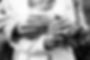 Black and white bride and groom placing on wedding rings