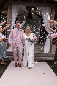 the couple exit the gazebo for their confetti exit