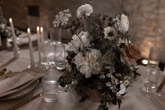 Ribbed glassware sits between stunning floral centre pieces full of texture and neutral tones