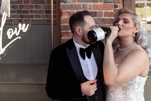 The bride and groom drinks prosecco