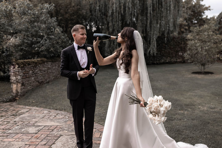 Bride and Groom drinking Champagne at Gate street, Surrey