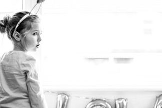 Girl in front of window in black and white