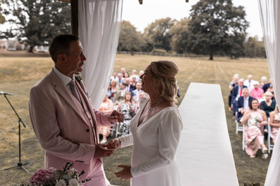 a touching moment between the bride and groom