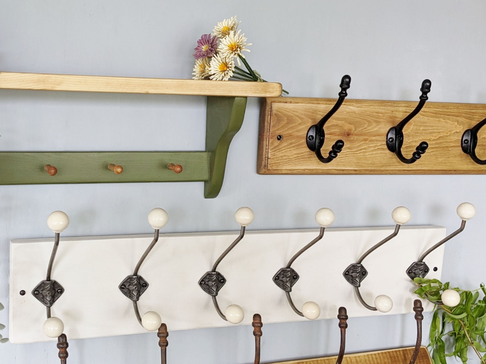 A n image of several wall mounted shelves and coat racks in different styles