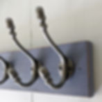A vintage wooden coat rack, painted with Annie Sloan Chalk Paint in the shade Old Violet